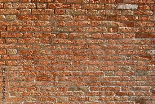 Fotografie Weathered red brick wall texture in Venice Italy as background copy space