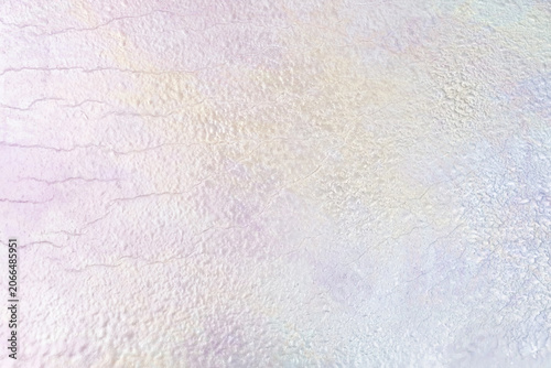 Pearlescent pastel texture background with subtle reflections.
