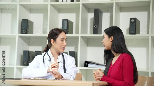 Professional dentist consulting with a patient in a modern dental clinic, explaining teeth restoration, prosthetic options, oral health care, treatment plans, and dental hygiene during a routine check