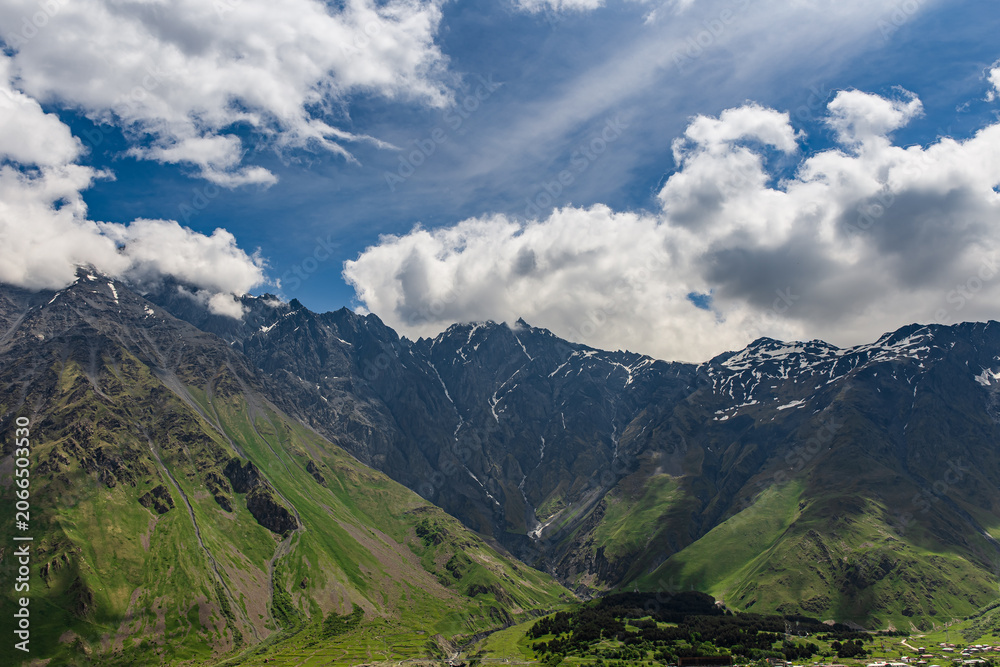 Fototapeta premium mountain landscape with blue sky stepantsminda, caucasus, georgia,