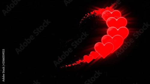 Glowing red hearts trail in a curved motion on a black background