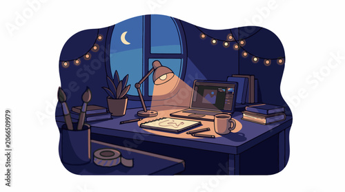 An artist's desk with laptop, books, and a lamp at night