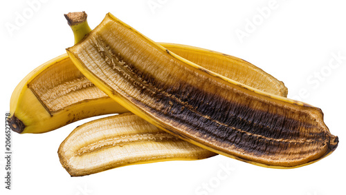 Картината върху платно Isolated banana peels discarded food waste, brown and yellow fruit skin, aged an