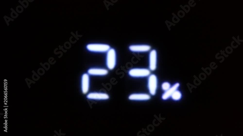 twenty-three percent LED flashing digit on a black background