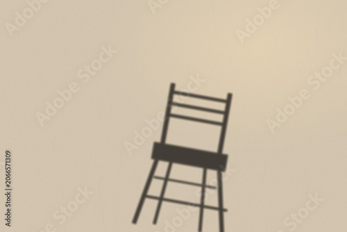 Illuminated Shadows of the City – Chair Shadow on Warm Wall