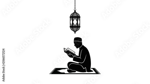 Obraz na płótnie Silhouette of man reading Quran under hanging lantern.
