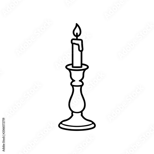 Black and white candle on holder 1.