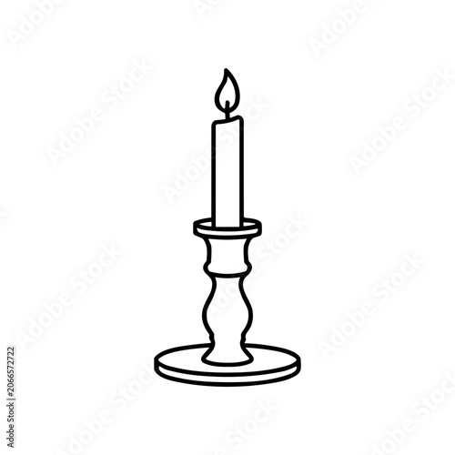 Black and white candle on holder.