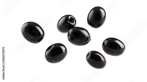 Obraz na płótnie Seven glossy black olives scattered on white