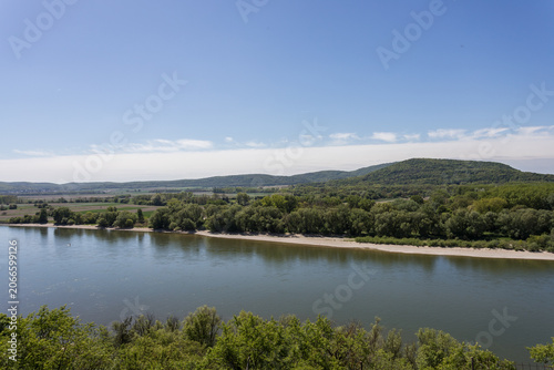 Scenic River Bend with Hills and Lush Greenery