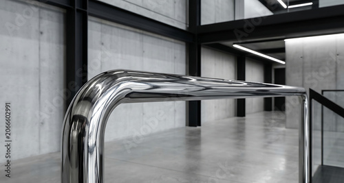Polished Chrome Handrail in Modern Minimalist Concrete Interior