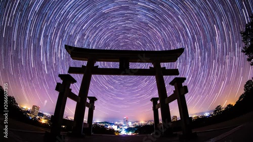 Japanese Torii gate under circular star trails.