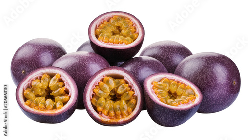 Schilderij op canvas Isolated fresh whole and half-cut passion fruits revealing vibrant pulp and seed
