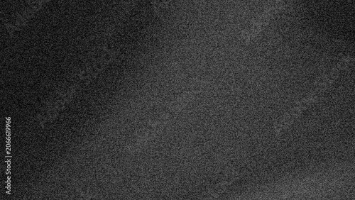 Fotografi a dark, grainy image of static noise with subtle flickering patterns and a faint