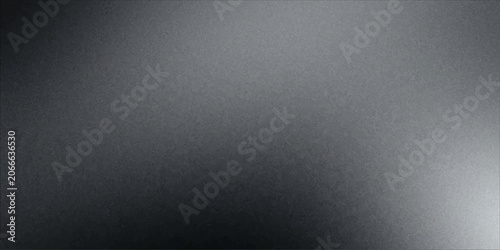 Bild auf Leinwand A brushed metal surface with a gradient of gray tones, reflecting light on the lower right corner