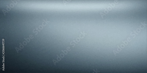 Brushed metal surface reflecting subtle light, conveying a sense of modern sophistication and industrial elegance.