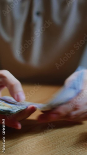 Man counts money with hands, trader or businessman counts salary banknotes. Male counting USD cash. Business crisis finance. Close-up of lifestyle, hand counting paper dollars, american paper