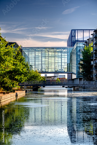 Photography Vertical close-up photo glass building by the water in academic district Amagerbro, Copenhagen, Danish architecture