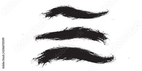 Fotografie Set of three hand-drawn black ink brush strokes with rough edges.