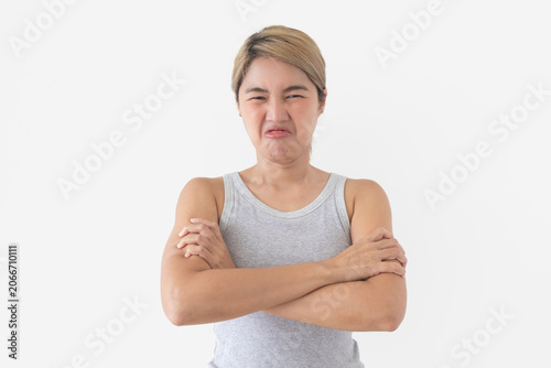 Foto Young Thai woman showing strong disgust, grimacing with a wrinkled nose and crossed arms