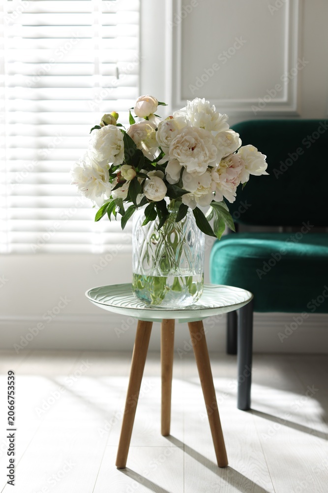 Fototapeta premium Bouquet of beautiful peony flowers on table at home