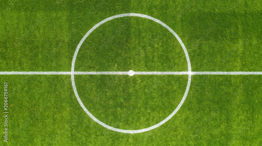 Fototapeta premium Overhead football pitch center circle with horizontal white line