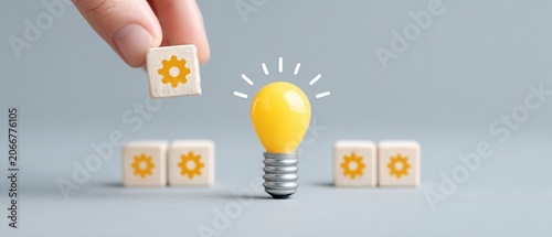 Creative light bulb with gear icon token surrounded by puzzle pieces representing innovation and ideas