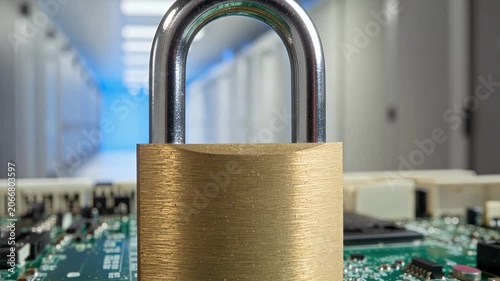 Brass padlock on a circuit board with a blurred data center hallway in the background, symbolizing digital security and data protection.