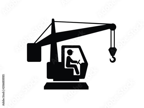 Silhouette of worker operating crane machine