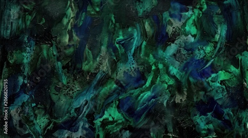 A dark, abstract image resembling a marbled stone or liquid surface. Deep teal, emerald green, and sapphire blue hues blend and swirl together, creating a dynamic and textured composition.