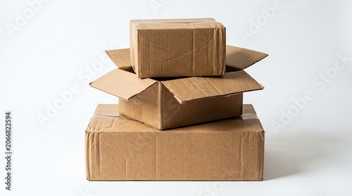 Stacked cardboard boxes for shipping and storage on white background