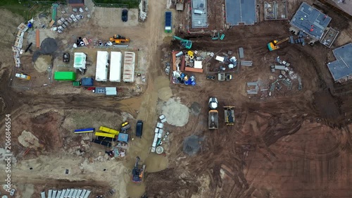 A construction site in Boroughbridge with different types of machinery and equipment. The area is busy with activity and shows materials spread out across the yard