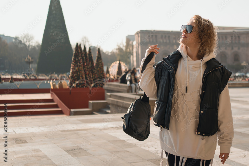 Obraz premium Adult fashion outfit woman at walk in Yerevan during Christmas holidays