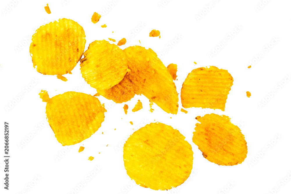 Naklejka premium potato chips and crumbs float dynamically against a clean white background. 