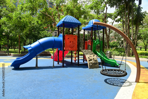 Climbing structures and slides are playground equipment for children, which are part of the public park in Bangkok capital city , Thailand.