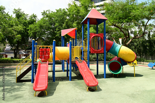 Climbing structures and slides are playground equipment for children, which are part of the public park in Bangkok capital city , Thailand.
