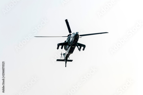 Military helicopter air attack by a squadron on isolated white background