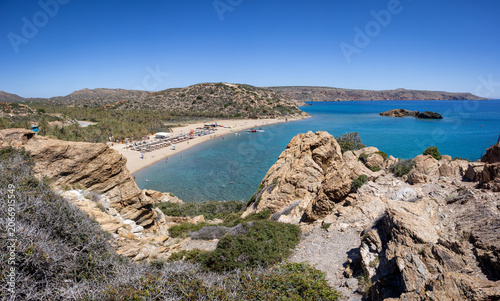 High angle view down to vai beach with palm trees in the north eastern part of the island crete, Greece. Large group of unidentifiable people in the distance.