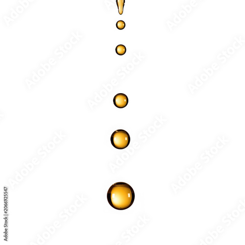 Golden liquid droplets falling in sequence.