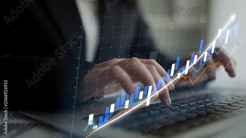 Принти на полотні A focused businessman analyzes financial data on his laptop, utilizing advanced techniques for data visualization to develop effective growth strategies in today competitive market