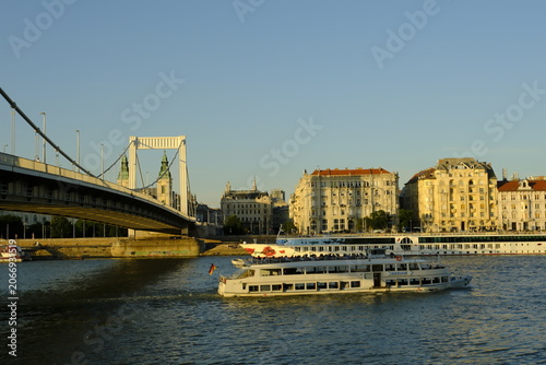 Konstfotografi Tour boats on the Danube River with the Inner City Parish Church and Elisabeth B