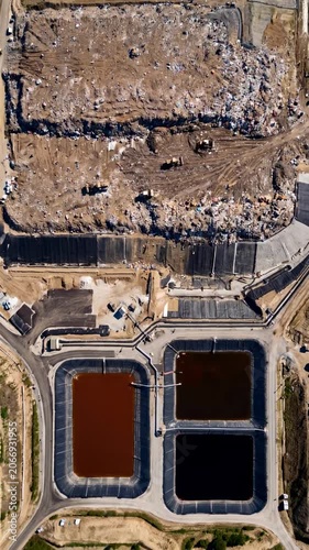 Aerial view of landfill site showing waste accumulation and water