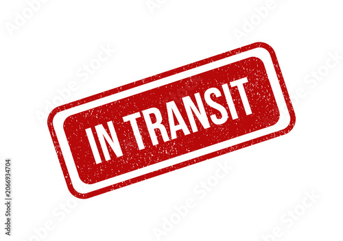 Red grunge rubber stamp with the text in transit on a rectangle shape