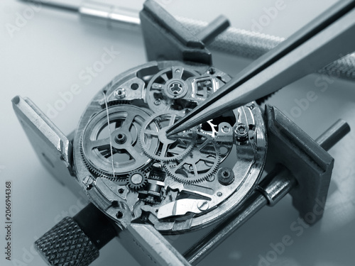 Macro photography concept of internal mechanism and vintage gears of a mechanical watch under repair