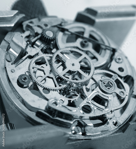 Macro photography concept of internal mechanism and vintage gears of a mechanical watch under repair