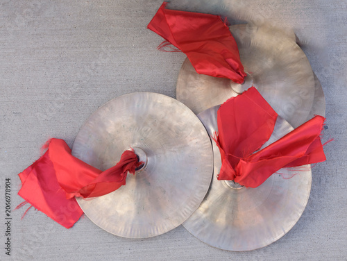 Chinese cymbals adorned with red tassels