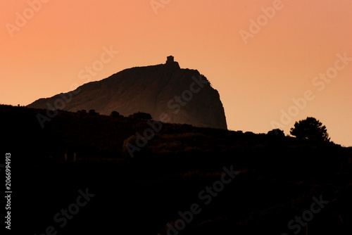 Photography Genoese Turghiu tower at sunset, in the Corsican coast