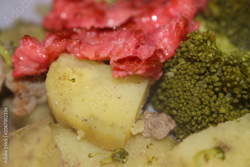 meal with meat and vegetables. Sweet potato and broccoli dish. Nutritious fitness food with sausage. Meal with meat, sweet potato, broccoli and shredded sausage.