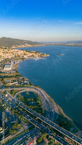 High Angle Aerial Shot of Baia Sul Landfill with Highway Intersections and Coastal City Landscape in Florianopolis Santa Catarina Brazil