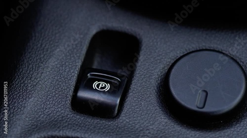 Female Finger Releasing Electronic Parking Brake Button Close Up Macro Shot Disengaging Electric Handbrake in Modern Car 4K
